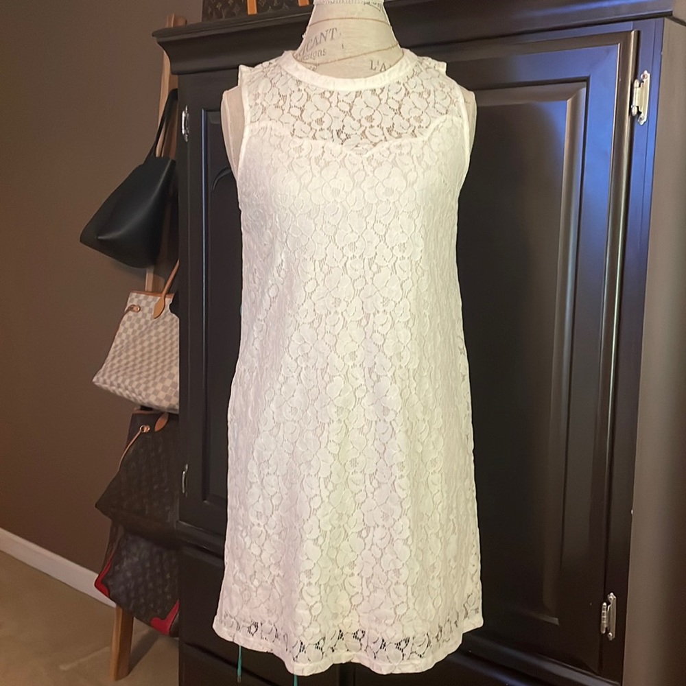 Sleeveless white lace dress